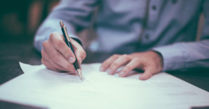 To co-sign means to sign along with someone else. The contract will now have two signatures, yours and your friend’s. By cosigning you and your friend are committing to pay back the loan with interest. Learn more by listening to this podcast episode.